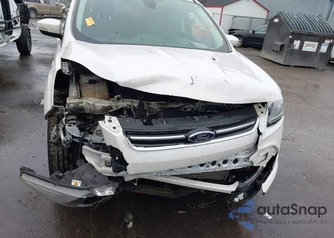 2014 Ford Escape Titanium z USA, uszkodzony, nr VIN 1FMCU9J91EUB77770